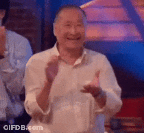 Man In White Shirt Applauding And Smiling GIF