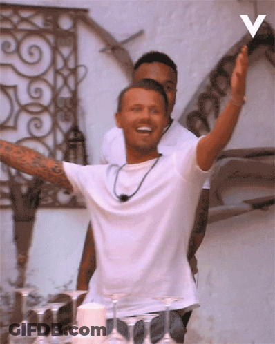 Man In White Shirt Arms Outstretched V Wall GIF