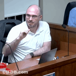Man In White Shirt At Desk With Laptop And Microphone GIF