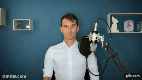 Man In White Shirt At Microphone GIF