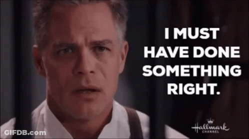 Man In White Shirt Behind Bars Says I Must Have Done Something Right GIF