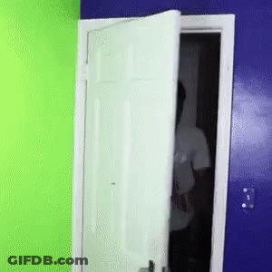 Man In White Shirt Behind Door GIF
