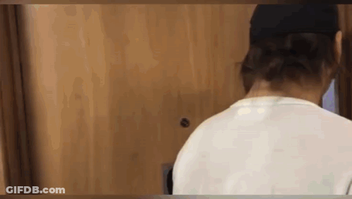 Man In White Shirt, Black Hat At Door GIF