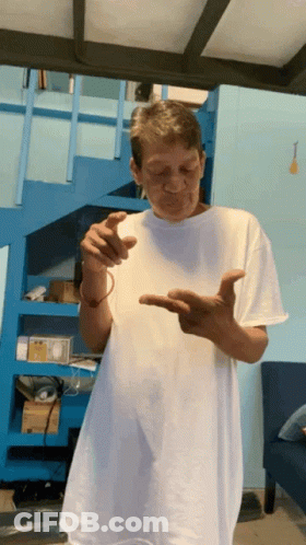 Man In White Shirt By Blue Stairs GIF