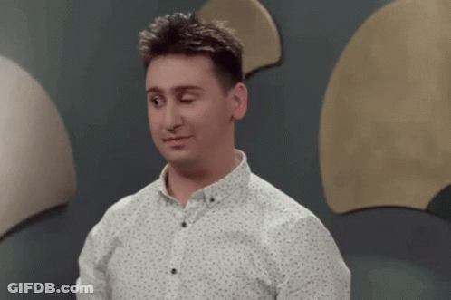 Man In White Shirt By Circle Wall GIF