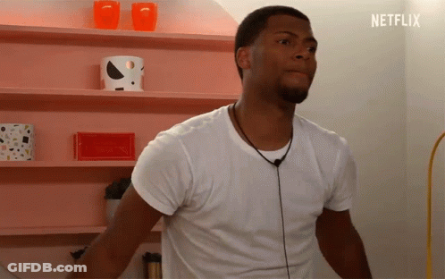 Man In White Shirt By Pink Netflix Shelf GIF
