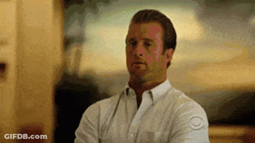 Man In White Shirt Crossing Arms Making Funny Face GIF