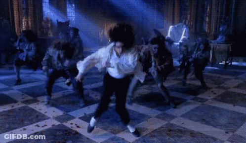 Man In White Shirt Dancing Before Werewolves GIF