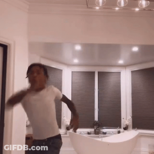 Man In White Shirt Dancing By Bathtub GIF