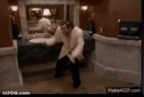 Man In White Shirt Dancing In Bathroom GIF