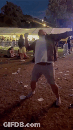 Man In White Shirt Dancing In Dirt GIF