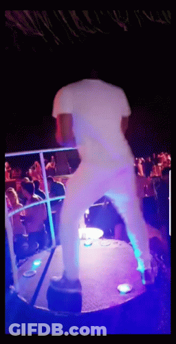 Man In White Shirt Dancing In Front Of Crowd GIF