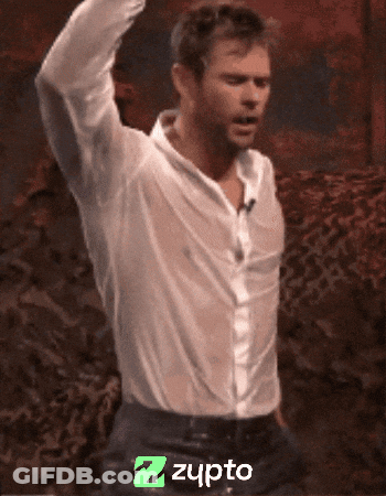 Man In White Shirt Dancing In Front Of Z Zupro Logo GIF