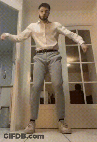 Man In White Shirt Dancing In Hallway GIF