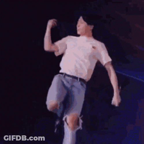 Man In White Shirt Dancing With Microphone GIF