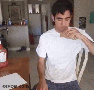 Man In White Shirt Drinking From Bottle GIF