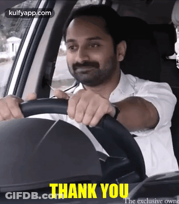 Man In White Shirt Driving Car Saying Thank You GIF