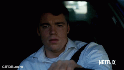 Man In White Shirt Driving Car With Netflix GIF