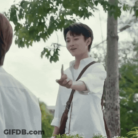 Man In White Shirt Giving Middle Finger With Brown Shoulder Bag GIF