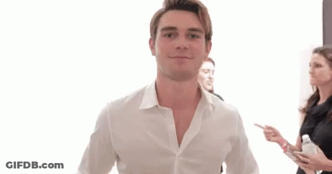 Man In White Shirt Giving Two Thumbs Up With Group GIF