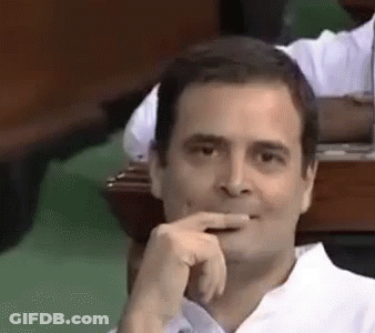 Man In White Shirt Hand To Mouth GIF