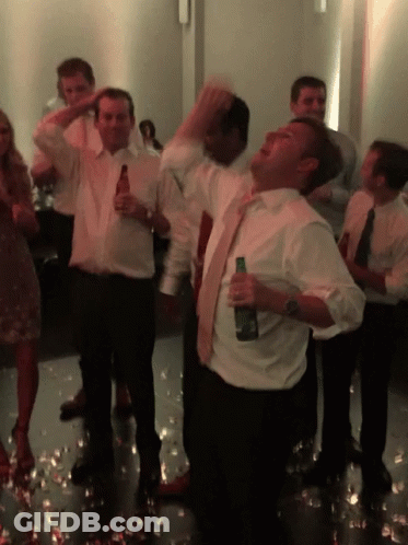 Man In White Shirt Holding Beer GIF