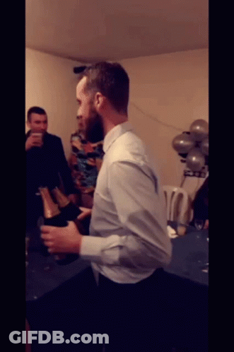 Man In White Shirt Holding Champagne GIF