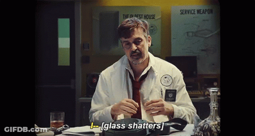 Man In White Shirt Holding Glass GIF