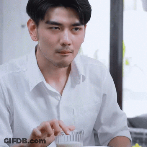 Man In White Shirt Holding Glass Of Milk GIF