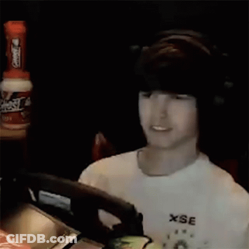 Man In White Shirt Holding Green Object GIF