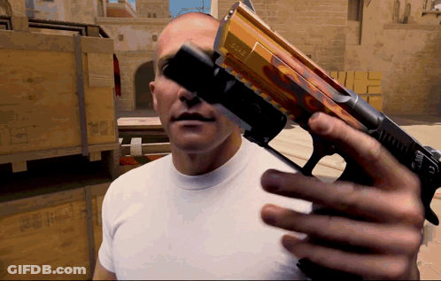 Man In White Shirt Holding Gun With Glock Sticker GIF