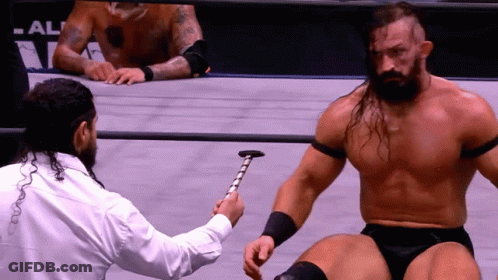 Man In White Shirt Holding Hammer GIF