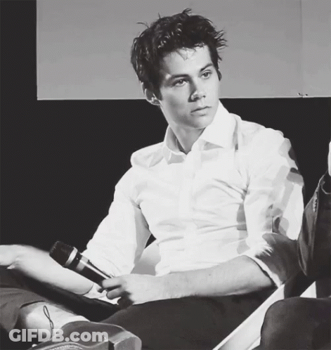 Man In White Shirt Holding Microphone GIF