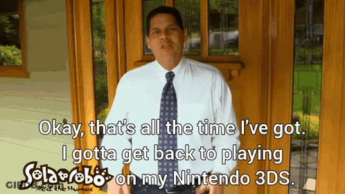 Man In White Shirt Holding Nintendo 3DS Game GIF