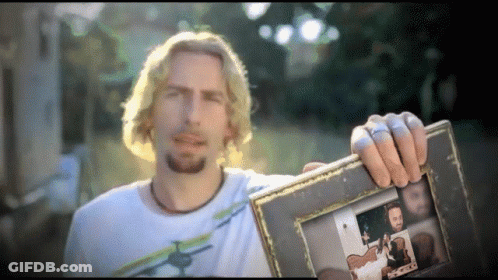 Man In White Shirt Holding Picture Frame GIF