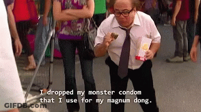 Man In White Shirt Holding Popcorn And Condom GIF
