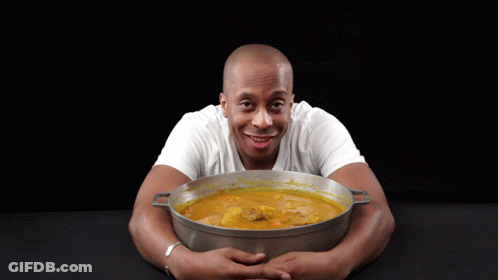 Man In White Shirt Holding Pot Of Soup GIF