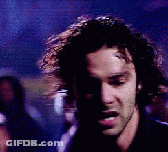 Man In White Shirt Holding Something GIF