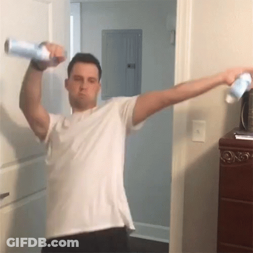 Man In White Shirt Holding Spray Bottle GIF