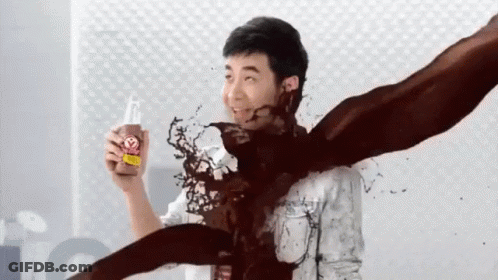 Man In White Shirt Holding Strawberry Bottle GIF