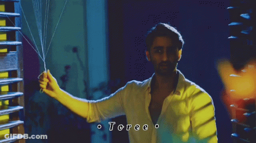Man In White Shirt Holding String Toree GIF
