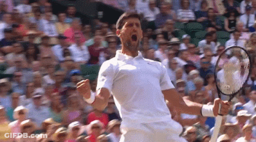 Man In White Shirt Holding Tennis Racquet GIF