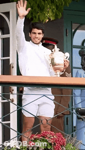 Man In White Shirt Holding Trophy GIF