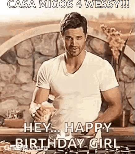Man In White Shirt Holding Water Bottle By Stone Wall GIF