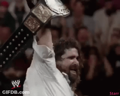 Man In White Shirt Holding Wrestling Belt GIF