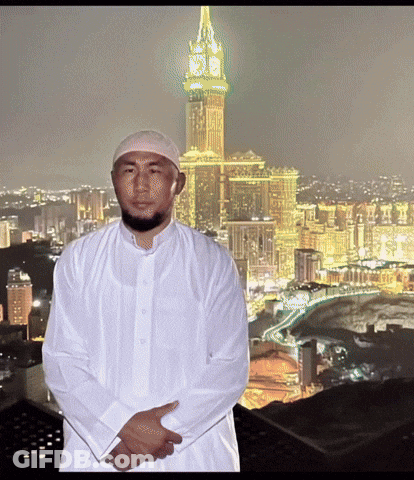 Man In White Shirt In Front Of Clock Tower Saying Clock Tower GIF