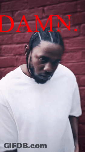 Man In White Shirt In Front Of Damn Wall GIF