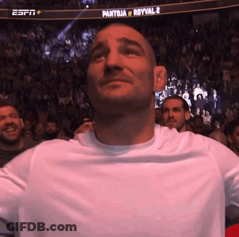 Man In White Shirt In Front Of ESPN Banner GIF
