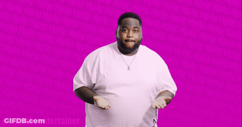 Man In White Shirt In Front Of Pink Background GIF