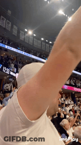 Man In White Shirt In Front Of Toyota Scoreboard GIF